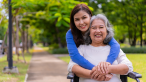 elderly dementia patient and young caregiver smiling